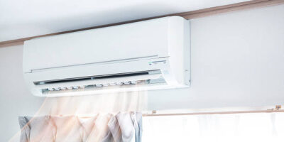 Air conditioner blowing warm air
