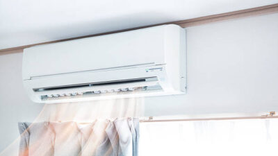 Air conditioner blowing warm air