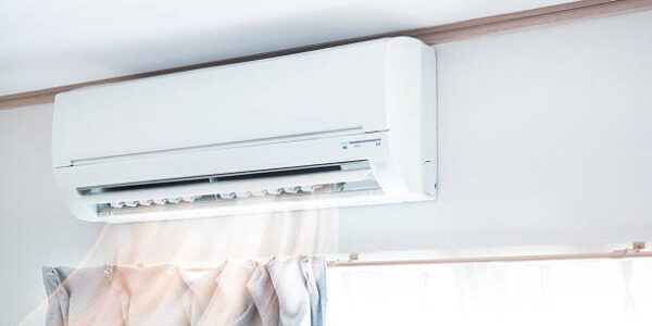 Air conditioner blowing warm air