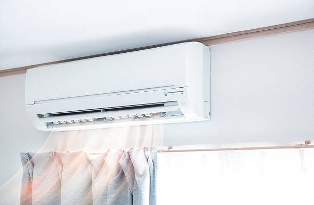 Air conditioner blowing warm air